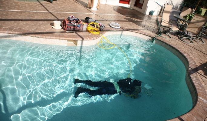 ALD technician searching for leak inside of pool